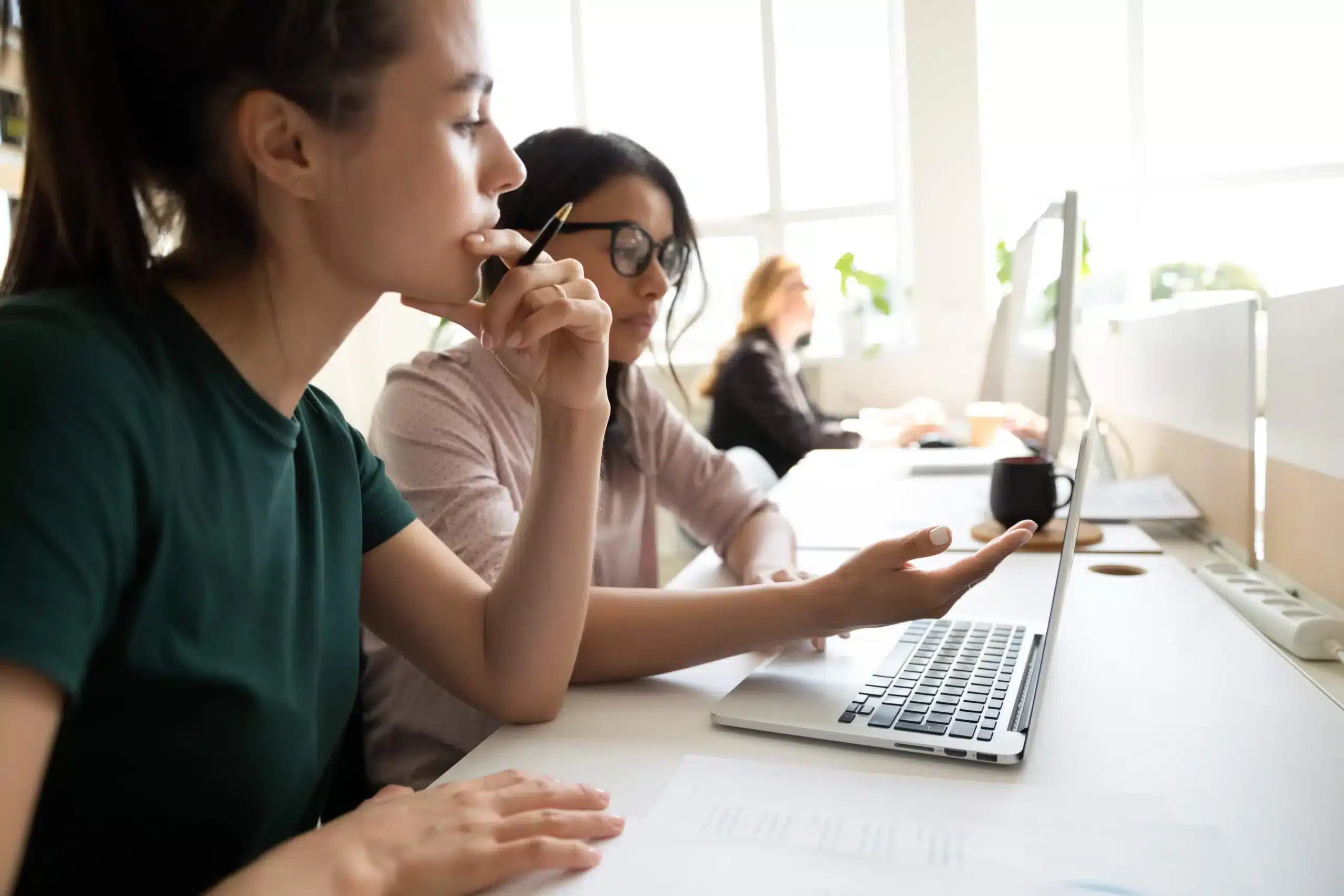 Women using the MV Data Tool at a computer